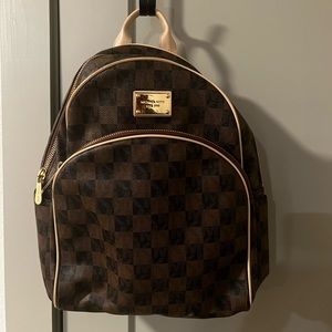 Michael Kors small brown checkerboard backpack